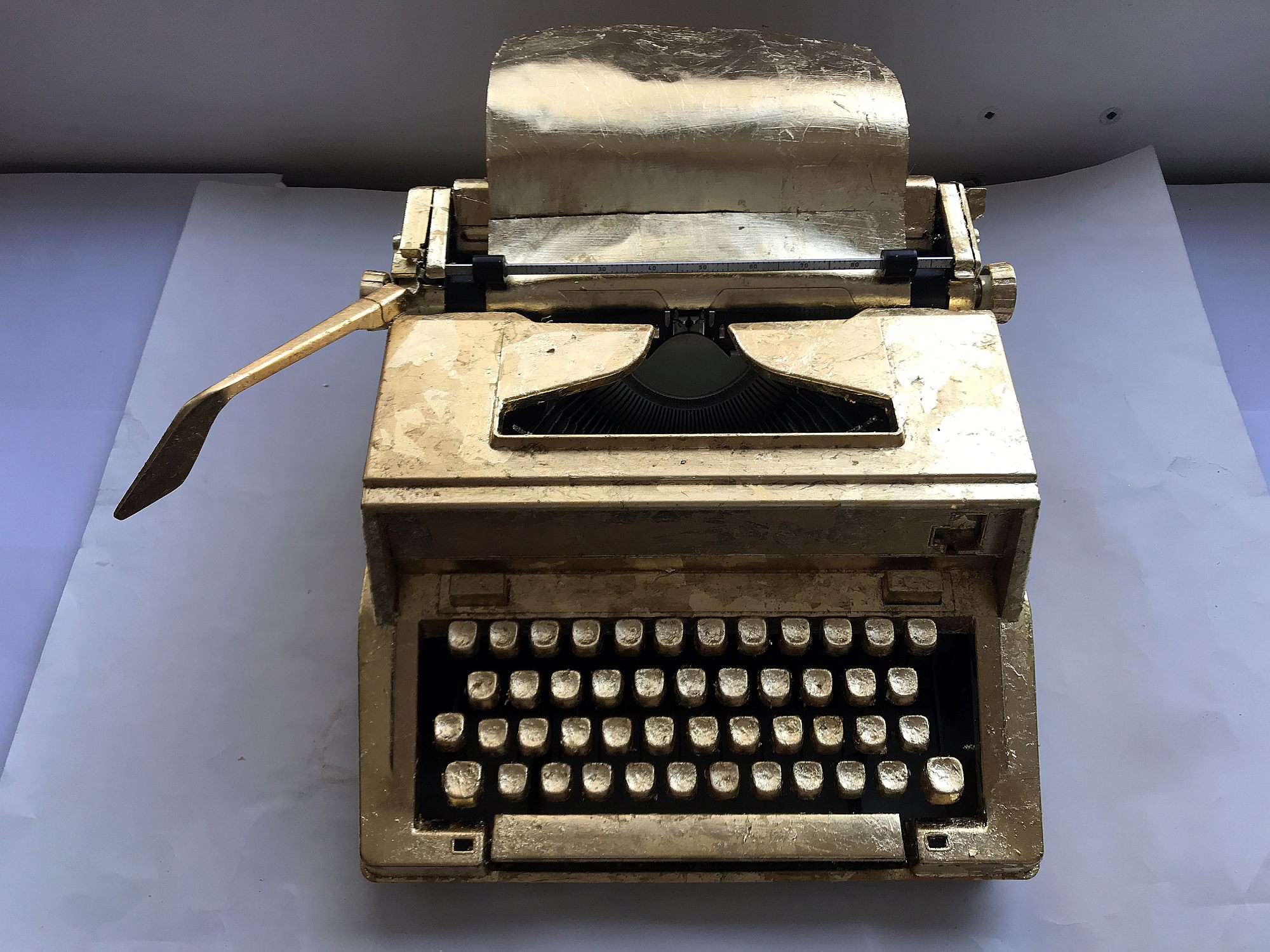 golden typewriter with application form